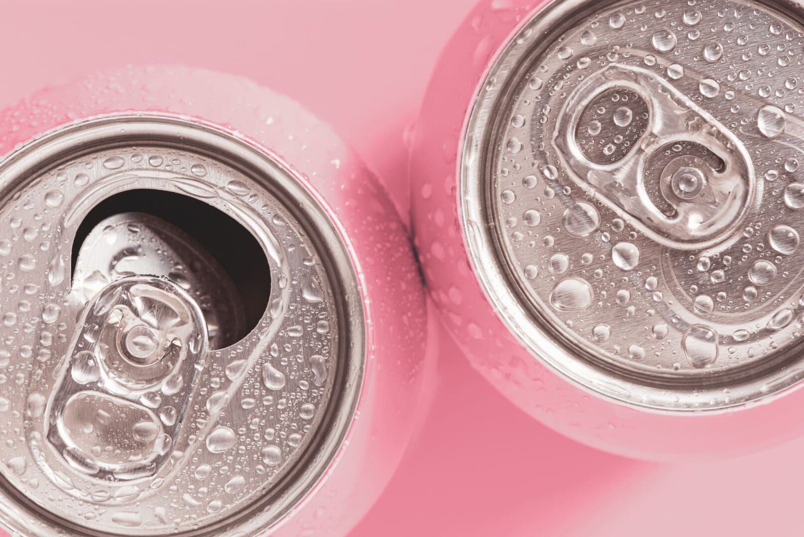 Cold beverage cans with water droplets