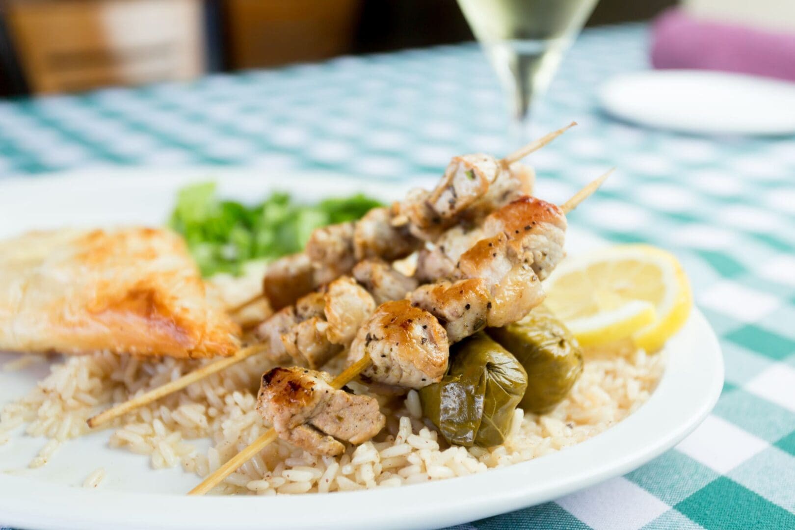 Chicken skewers and rice on a plate