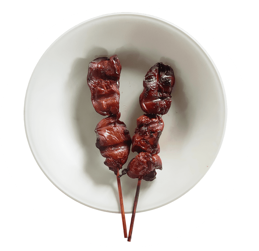 Two meat skewers on a plate